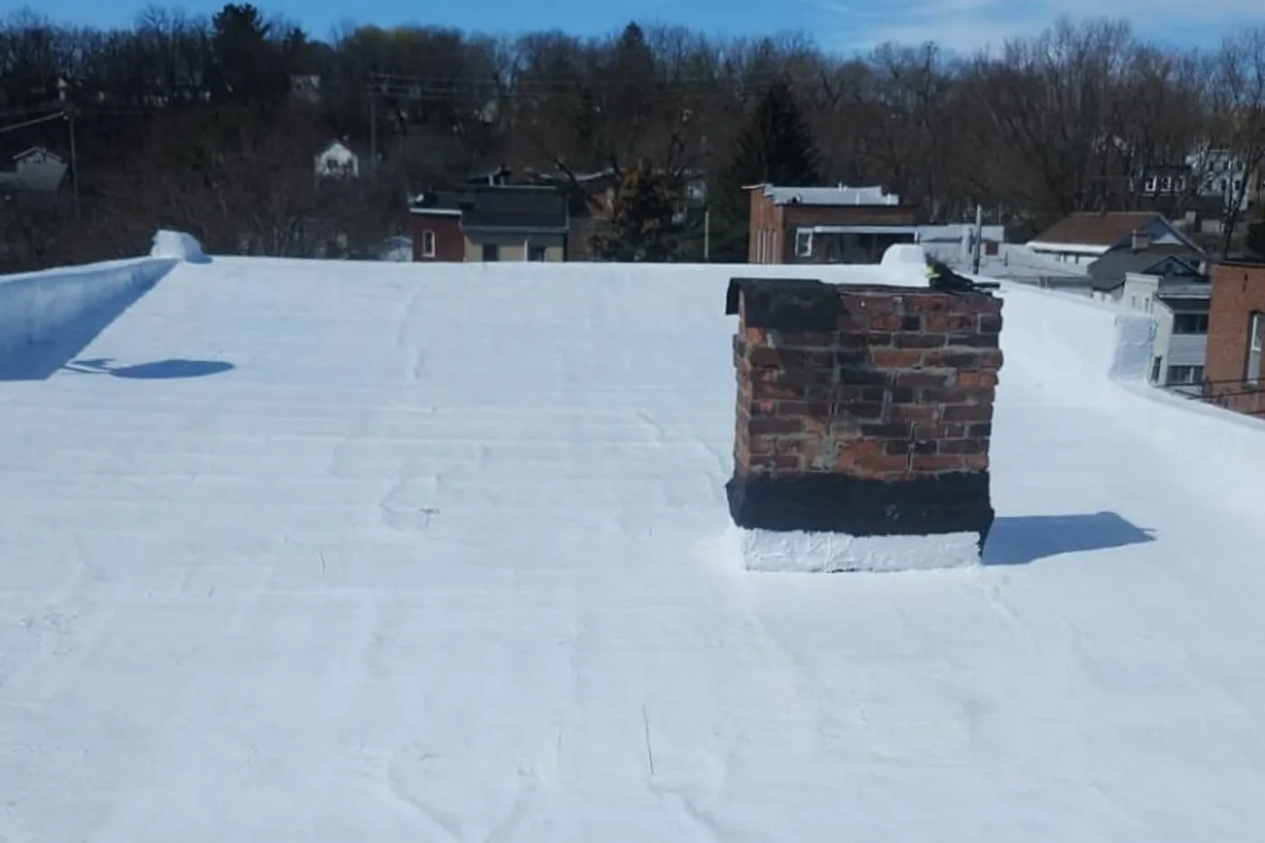 Flat commercial roof with a newly installed membrane system